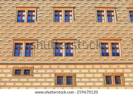 Painted facade of an old building mimics the brick pattern, Prague, Czech Republic