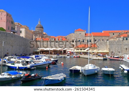 Leisure boats protected by the strong walls of Dubrovnik old town, Croatia