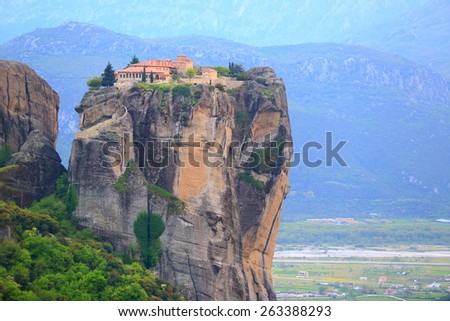 Old buildings of the Holy Trinity monastery elevated high above valley, Meteora, Greece