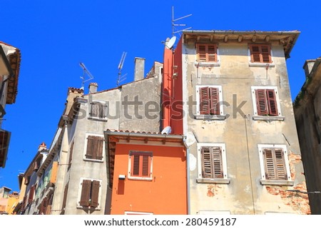 Sunny facades of old buildings inside Venetian town, Rovinj, Croatia
