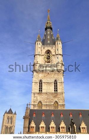 Sunny tower with Gothic architecture of the Belfry inside historical center of Ghent, Belgium