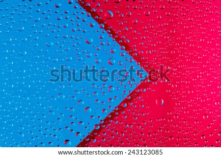 abstract background with blue and red arrow, and drops of water