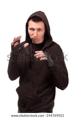 Young man in a hoodie standing in a fighting stance