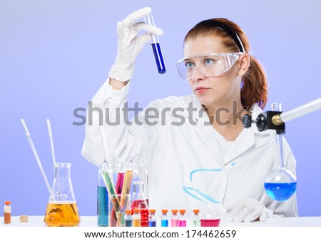 woman with test tubes in a chemistry lab