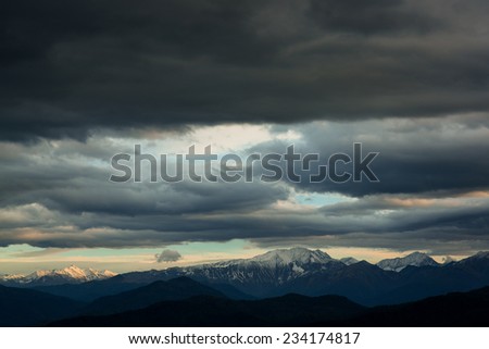 storm clouds on evening mountain
