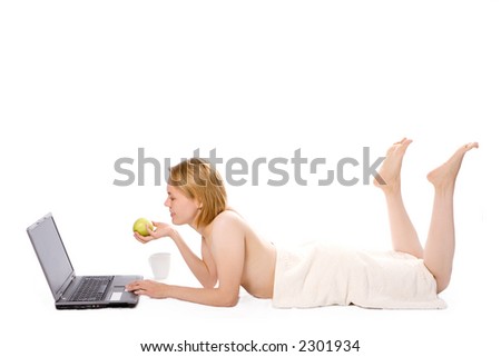 spa girl after shower with apple work on laptop on white background