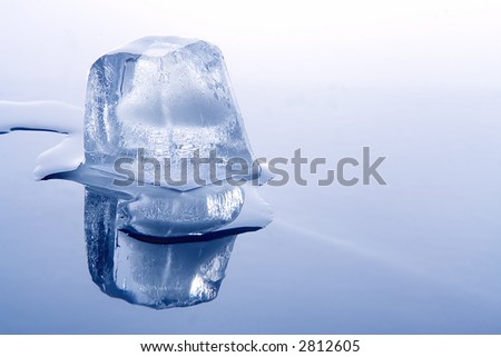 brick of ice and water on blue