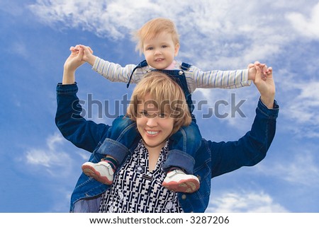 happy family kid sit on neck over blue sky