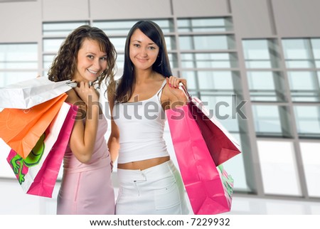 shopping women on glass interior of shop