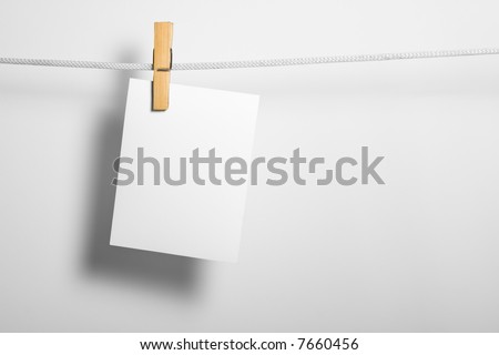 white paper blank on rope attach clothes-peg