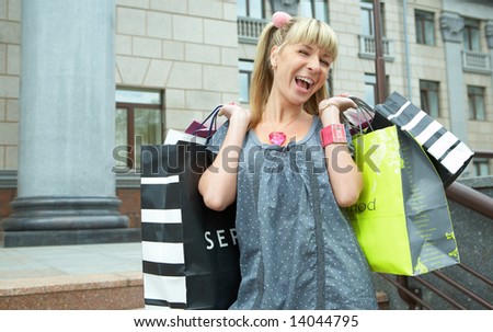 beauty shopping girl with packet on the city