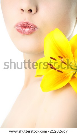 beauty woman with yellow lily on white background