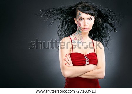 beauty woman portrait with rose pictures on face on black background