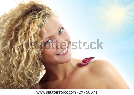 beauty woman portrait with butterfly on shoulder