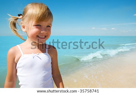 little girl child on coast of sea