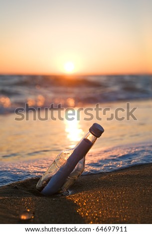 Message in a Bottle on sea beach