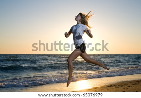 beauty woman running at sea beach