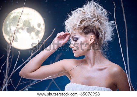 beauty woman  under moon in winter season