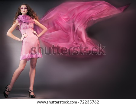 beauty woman in pink dress shooting mix light
