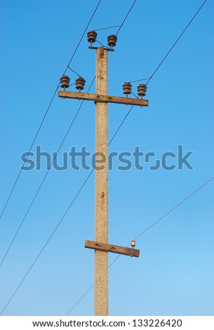 Railroad wire pole against clear blue sky