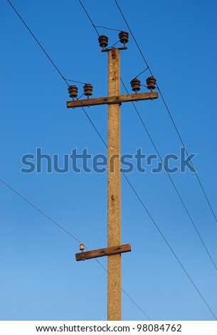 Railroad wire pole against clear blue sky