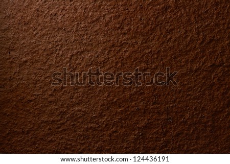 Dark brown terracotta texture closeup (design element)