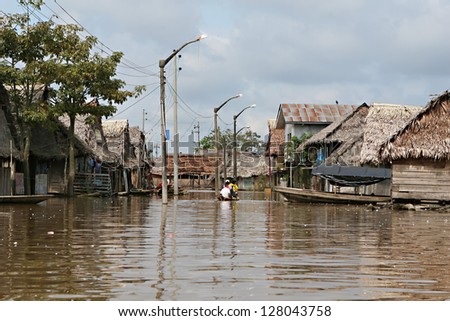 Flooded buildings in the polluted waters of Belen, Iquitos, Peru. Thousands of people live here in extreme poverty without clean water or sanitation.