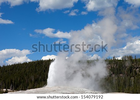 A geyser in Yellowstone National Park begins to erupt