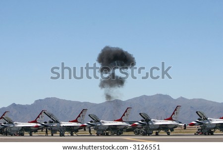Flight engineers test the performance of jets fighters on the tarmac at an air show