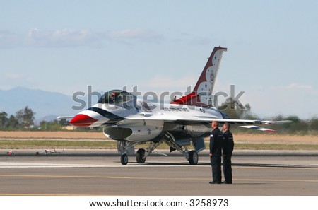 An F16 flighter jet is ready for take off.