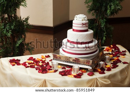 A beautiful wedding cake with flower petals