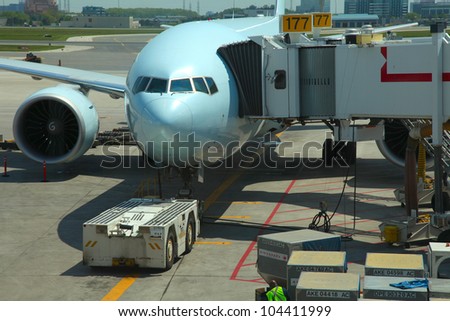 Loading cargo to the plane in the airport