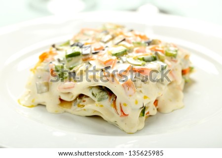 delicious meat  italian pasta lasagna with vegetables and white sauce