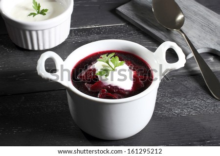 beets soup in white bowl gray background