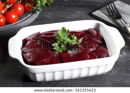 beets in white ceramic pan gray background