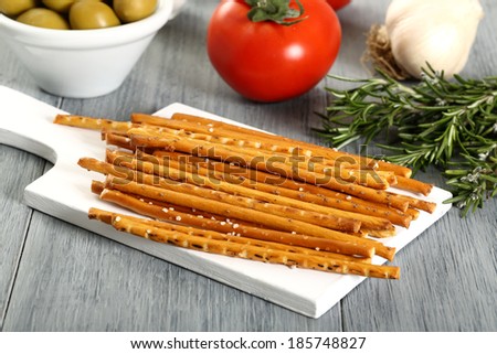 bread sticks on wooden table
