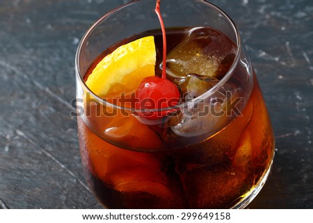 Old Fashioned Cocktail with Cherries and Orange