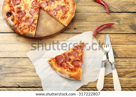 top view pepperoni pizza slice on rustic table background