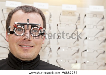 smiling man with eye check glasses on