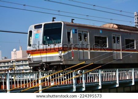 YOKOHAMA, JAPAN - October, 2014 : Tokyo Metro Train passing on Ootsuna Bridge at Yokohama:Tokyo Metro is a rapid transit system in the special wards of Tokyo Prefecture.