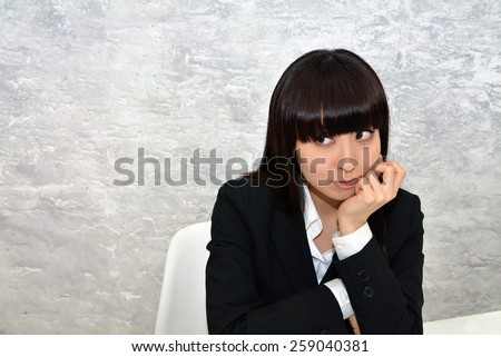 Business woman at the office in a bad mood