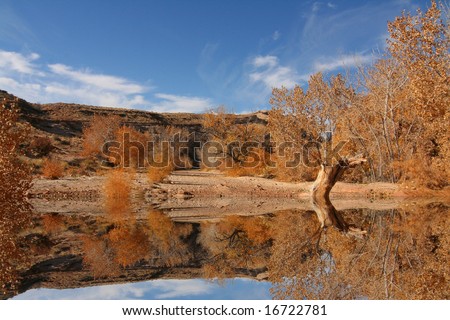 View of the red rock formations in San Rafael Swell with blue sky?s and water reflections