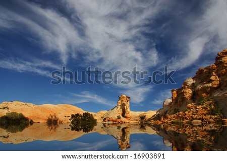 View of the red rock formations in San Rafael Swell with blue sky?s and clouds