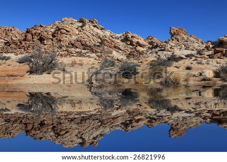 View of red rock formations in San Rafael Swell with blue skies