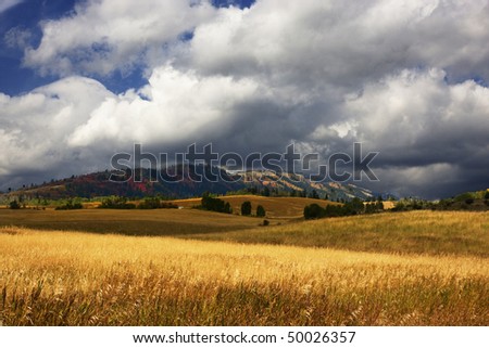 Storm on a high mountain farm in the fall