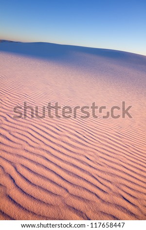 The sand dunes takes on pink colors at sunset, White Sands National Monument