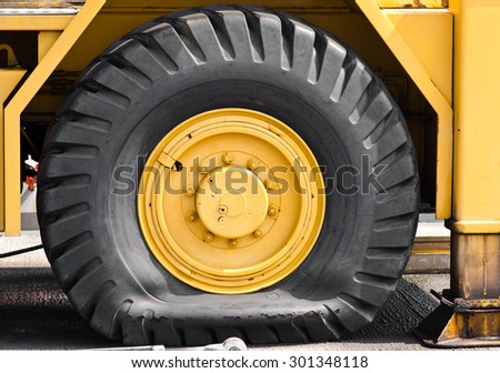 Flat tire of  yellow car