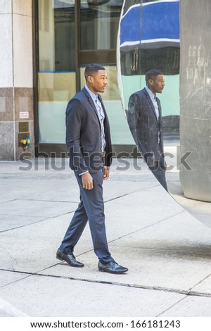 A young black businessman is walking, passed by a mirror,  and thinking. / Walking and Thinking
