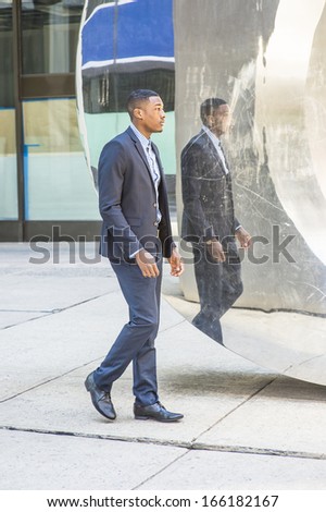 A young black businessman is walking, passed by a mirror wall,  and thinking. / Walking and Thinking