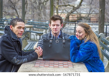 Three students are sitting by a table in a chilling winter, waiting for you. One guy looks mad. / Three friends waiting for you